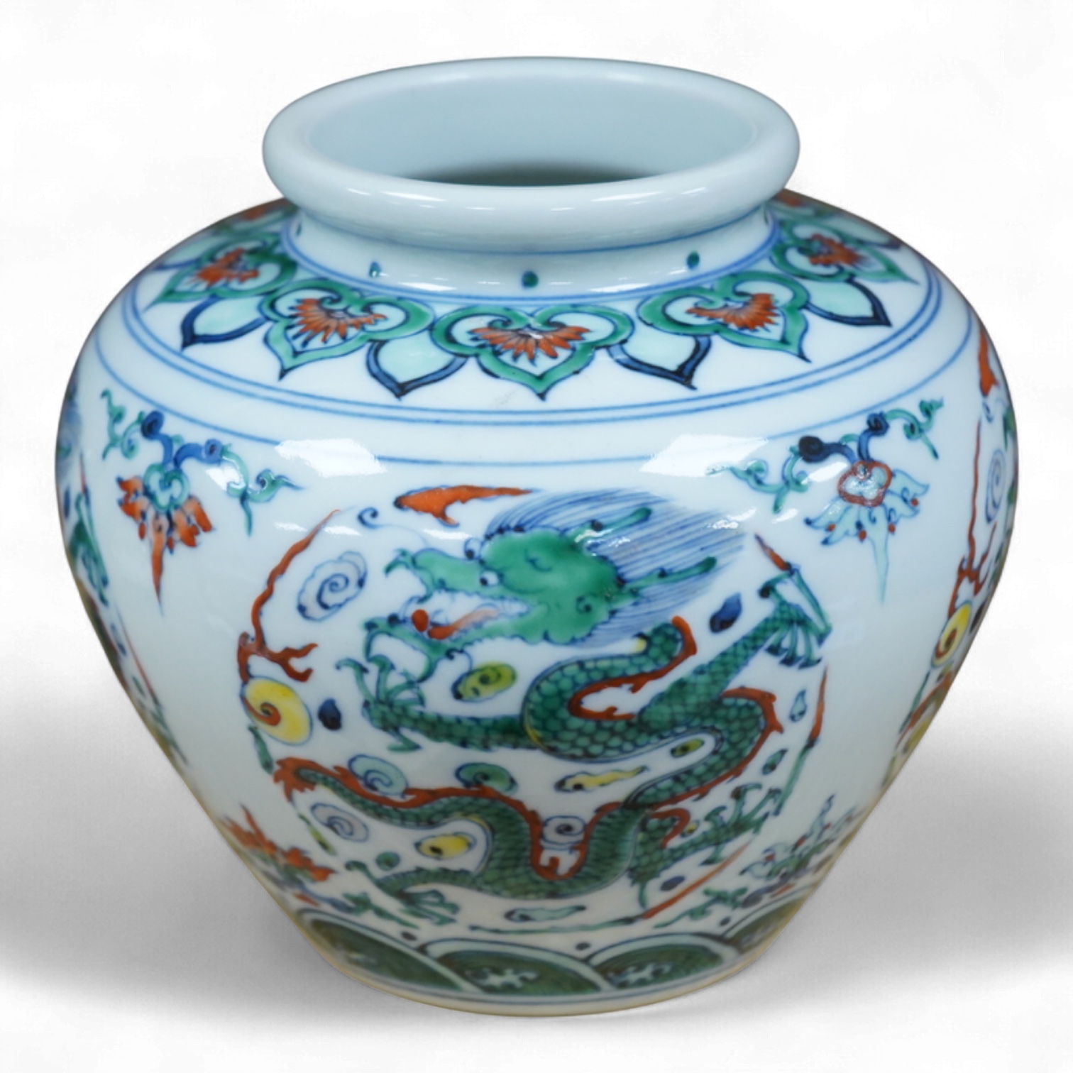 A Chinese doucai 'dragon' roundel vase, Kangxi mark but later, 13cm